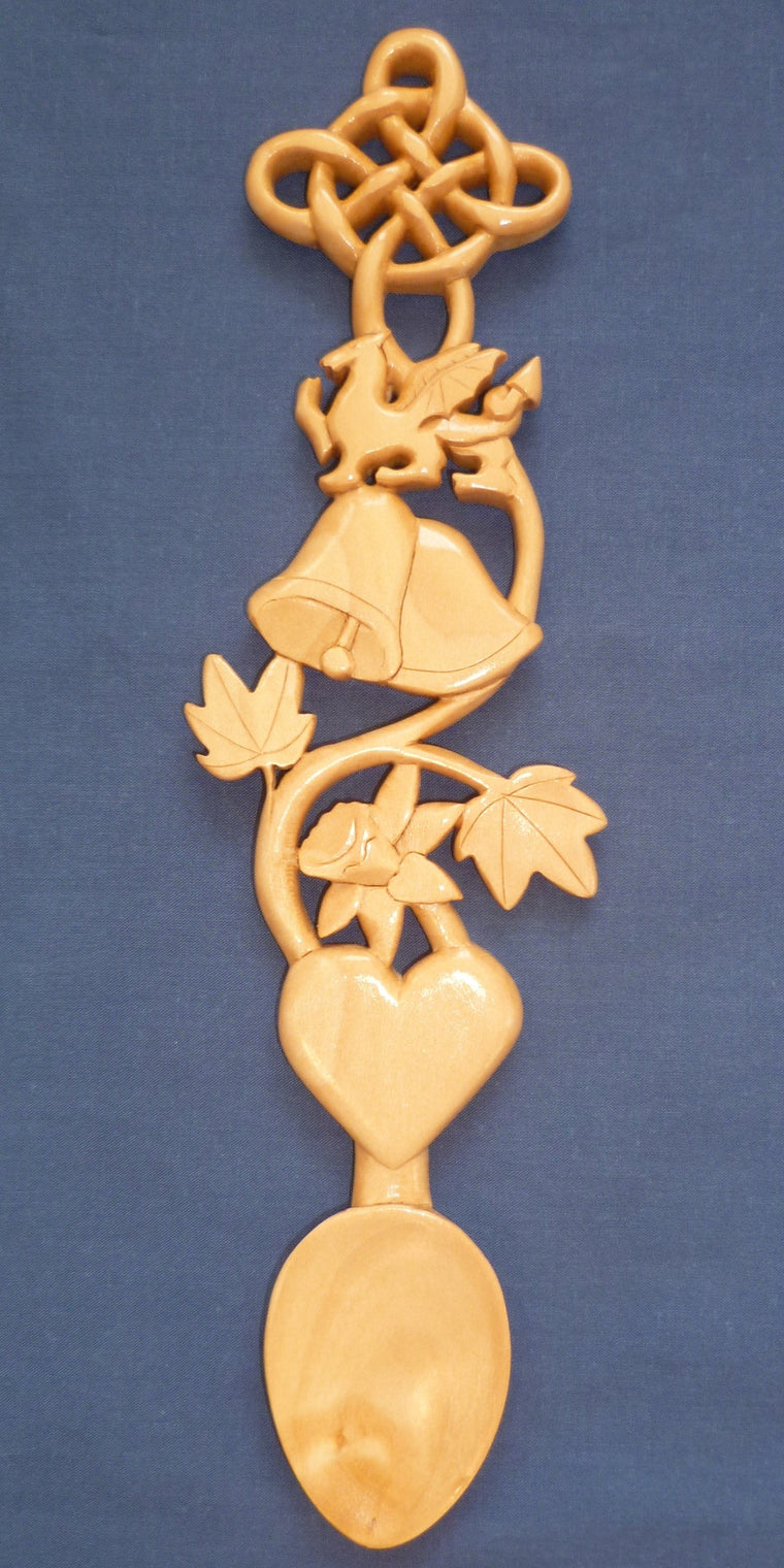 Wedding bells, dragon,daffodil and knot love spoon