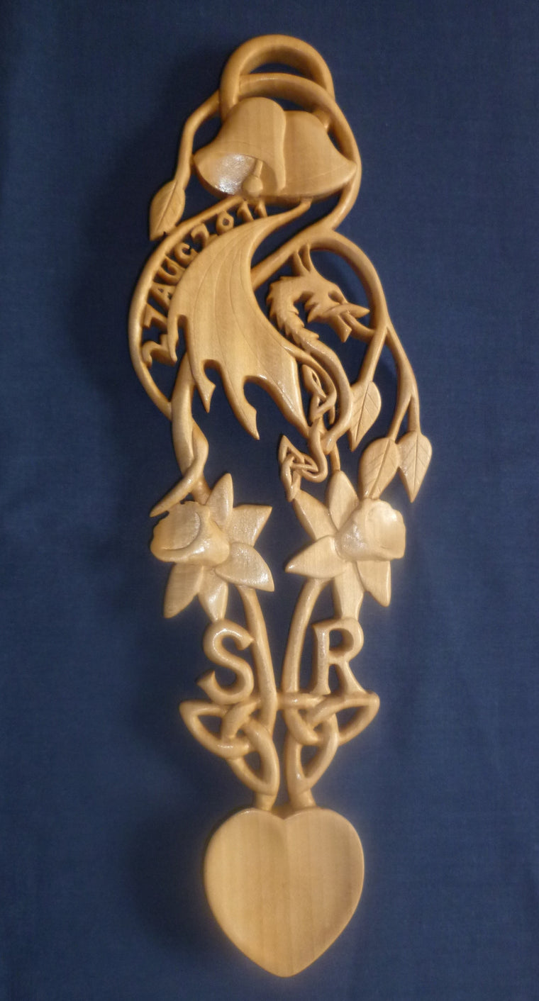 Celtic dragon with bells, daffodils, date and initials
