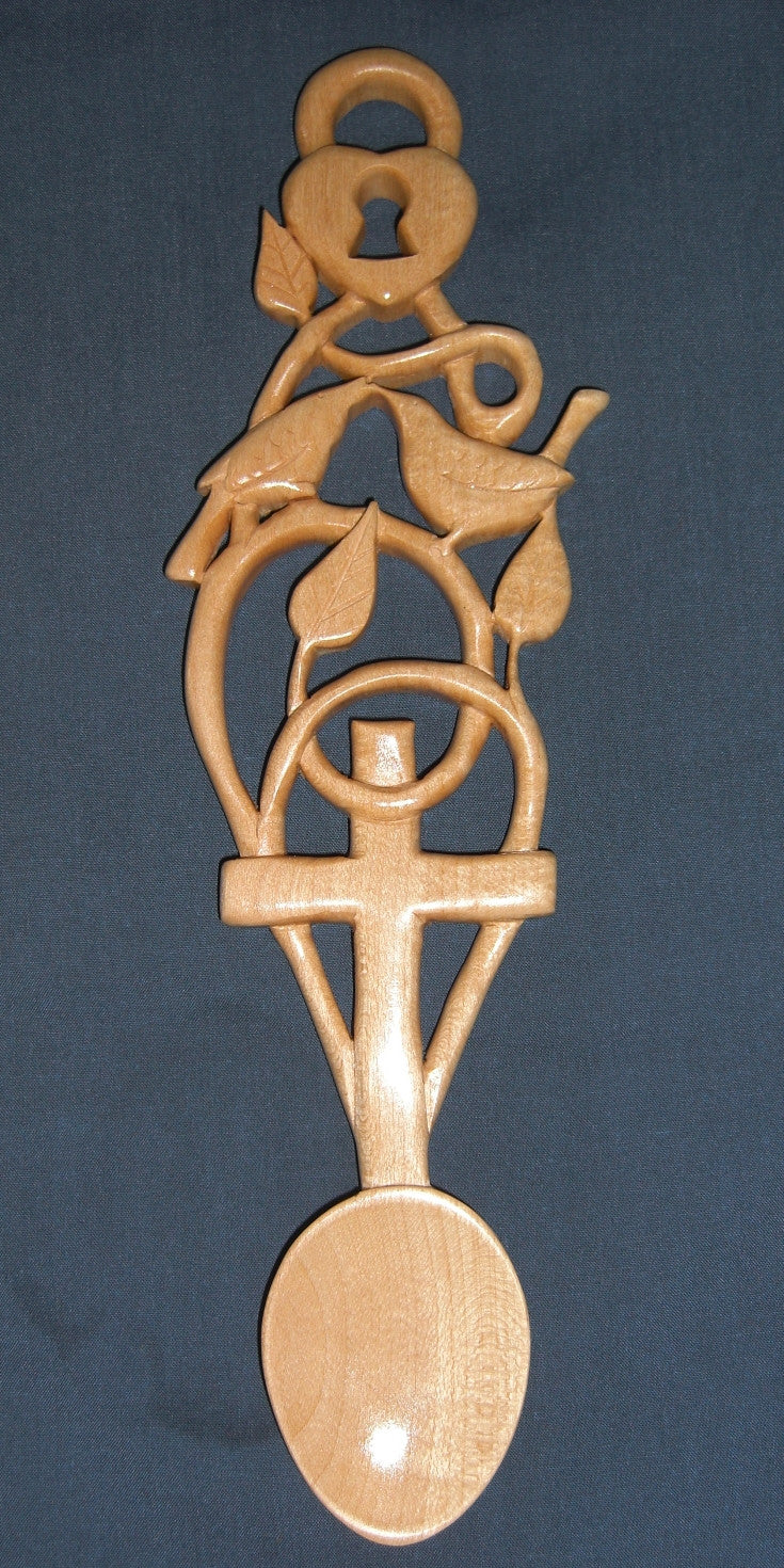 Lovebirds with cross love spoon